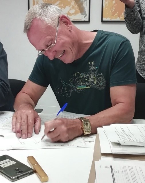 Chris Knight (TCF Pastor) signing for new Church Building on Wednesday, 17th April 2019