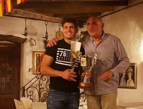 Carlos Lorente presented with the Full Monte Player of the Year award by supporters club President Eddie Cagigao.