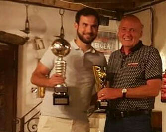 In safe hands - Carlos presented with the Manager's Player of the Year award by treasurer Howard Yeats.