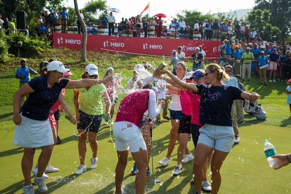 Christine Wolf of Austria is showered with water after her win. Credit: Tristan Jones