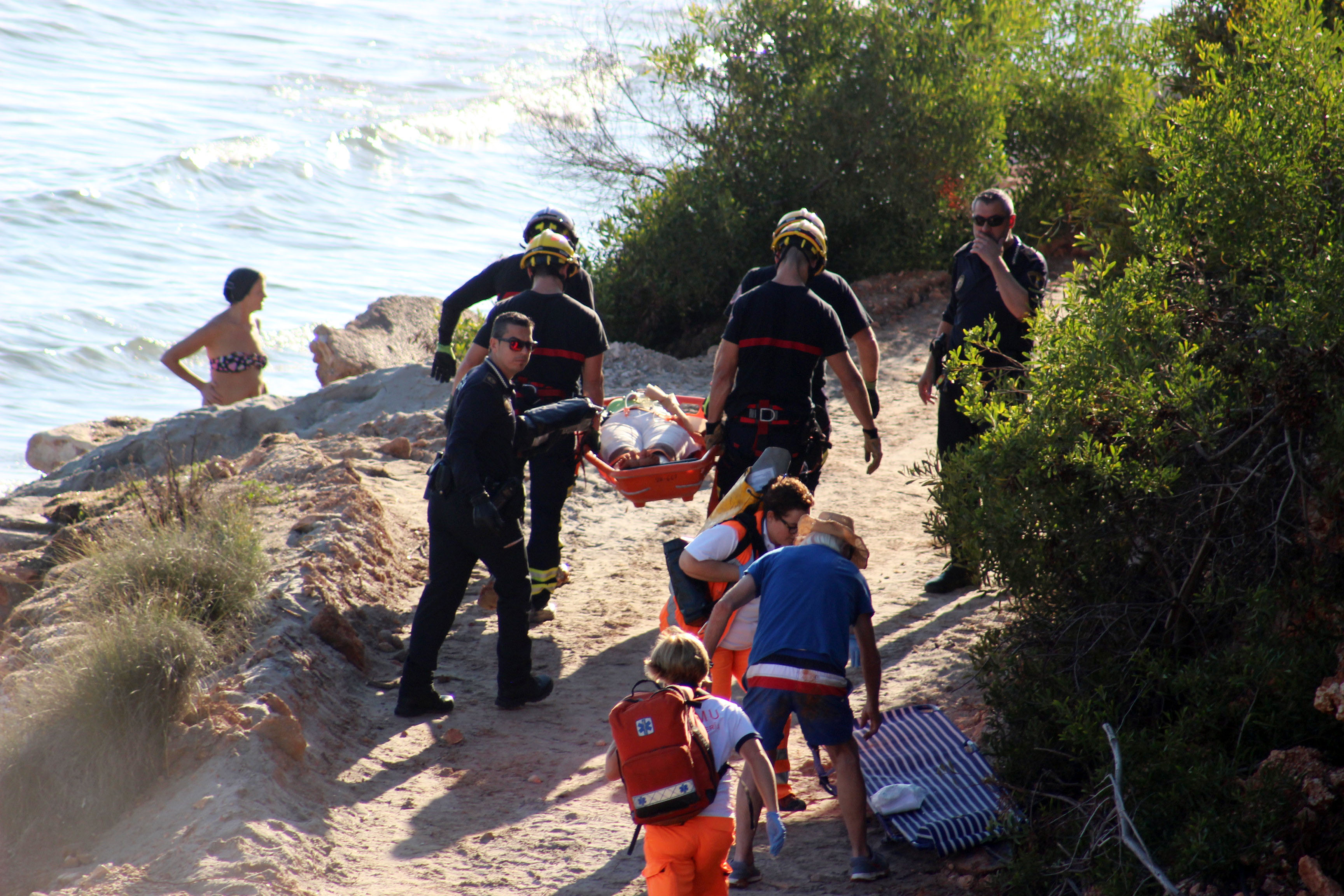 The injured lady was stretchered off the beach