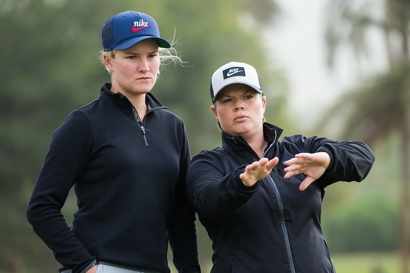 Lydia Hall of Wales shows Amy Walsh the way to paly the hole 