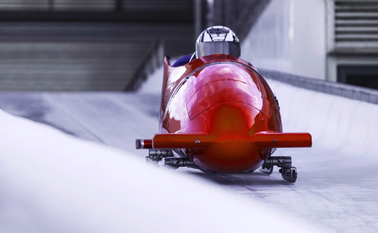 Red bobsled in an ice channel