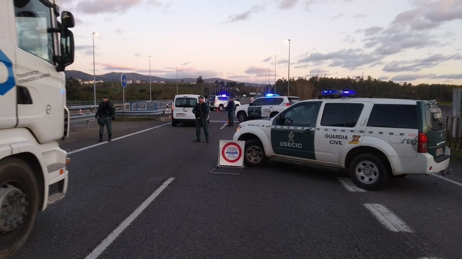 A police roadblock stopping traffic leaving Madrid