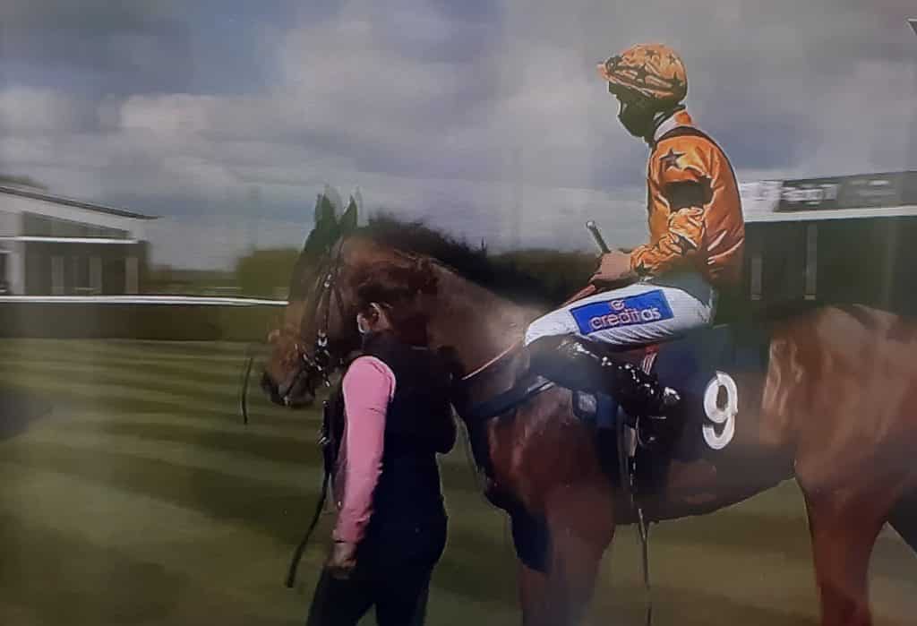 Tom Midgley and Rukwa lead into winner's enclosure.